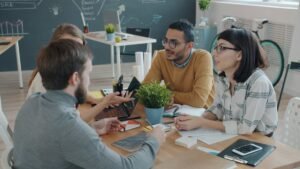Business team meeting to evaluate a B2B appointment setting agency, by IDEAIFY Solutions