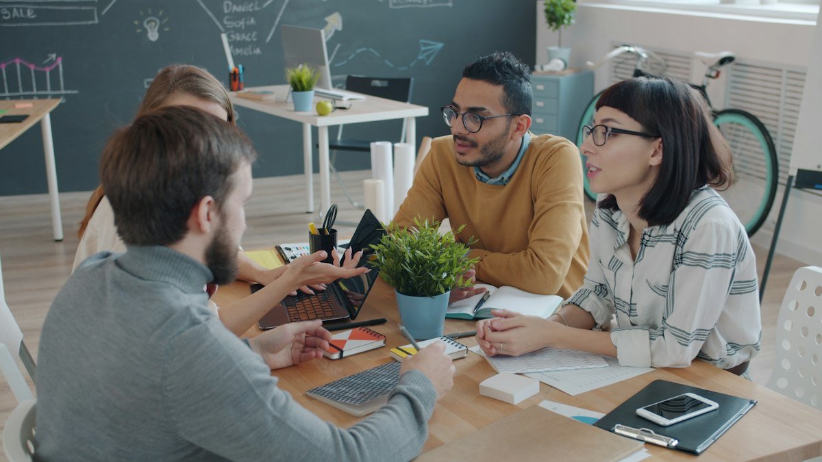 Business team meeting to evaluate a B2B appointment setting agency, by IDEAIFY Solutions