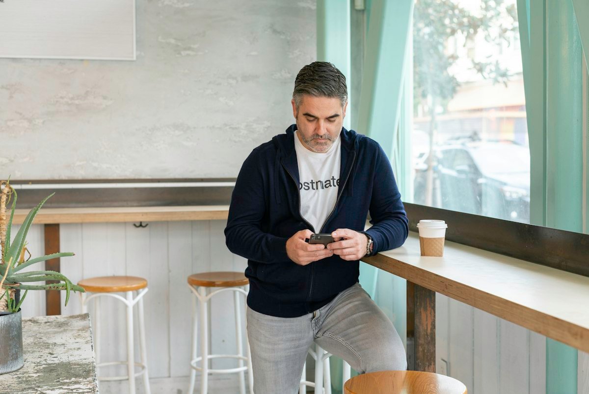 Salesperson on a phone call, representing signs of B2B cold calling agency ROI, by IDEAIFY Solutions